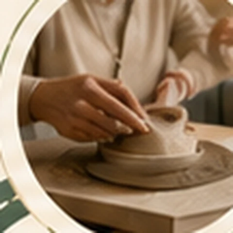 Hands shaping clay during a creative activity